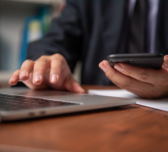 Businessperson using mobile phone contact us and communication working online internet